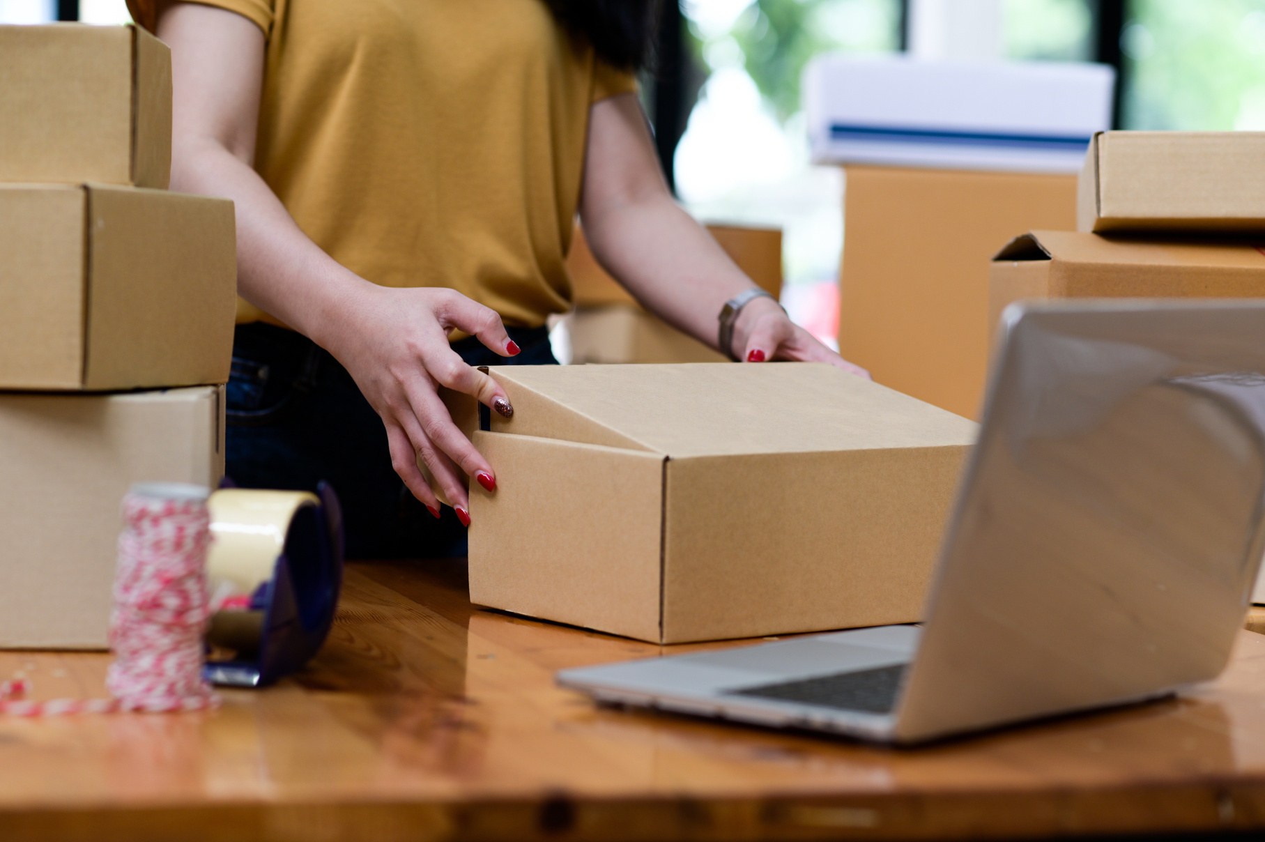 Woman Packing an Order  